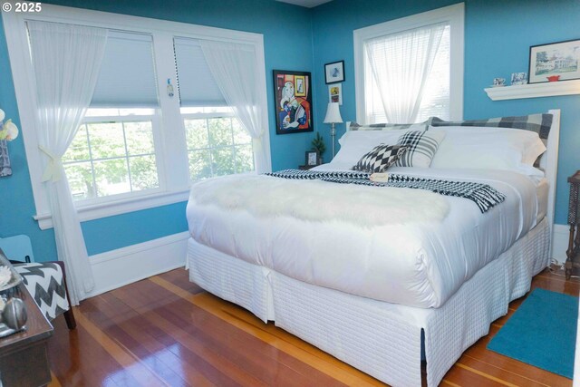 648 W Main St, Carlton, OR 97111 - bedroom with wood-type flooring and baseboards