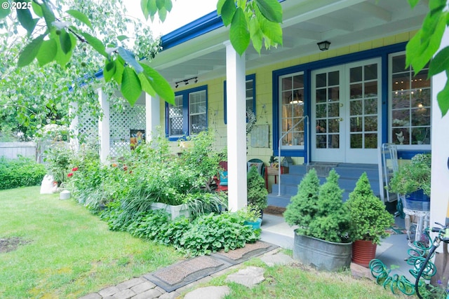 648 W Main St, Carlton, OR 97111 - doorway to property with covered porch, french doors, and a lawn