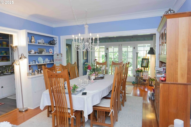 648 W Main St, Carlton, OR 97111 - dining space featuring a chandelier, crown molding, wood finished floors, and french doors