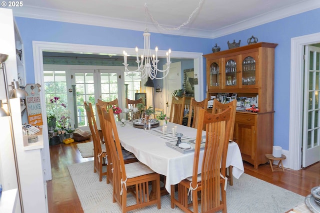 648 W Main St, Carlton, OR 97111 - dining room with a chandelier, wood finished floors, crown molding, and french doors