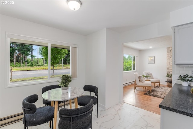 3434 Memorial Park Dr, Longview, WA 98632 - dining room featuring baseboard heating and light marble finish floors