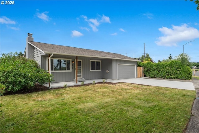 3434 Memorial Park Dr, Longview, WA 98632 - ranch-style home with a porch, a garage, concrete driveway, a chimney, and a front yard