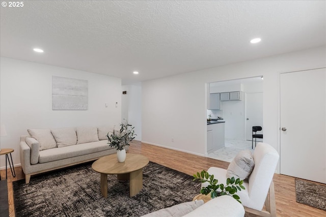 3434 Memorial Park Dr, Longview, WA 98632 - living room with light wood-type flooring, recessed lighting, and a textured ceiling