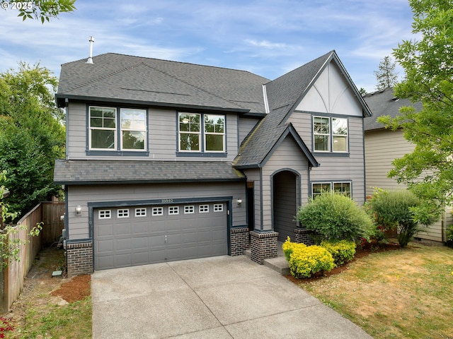 18840 SW Westland Ln, Beaverton, OR 97003 - view of front of property featuring driveway, an attached garage, brick siding, and roof with shingles