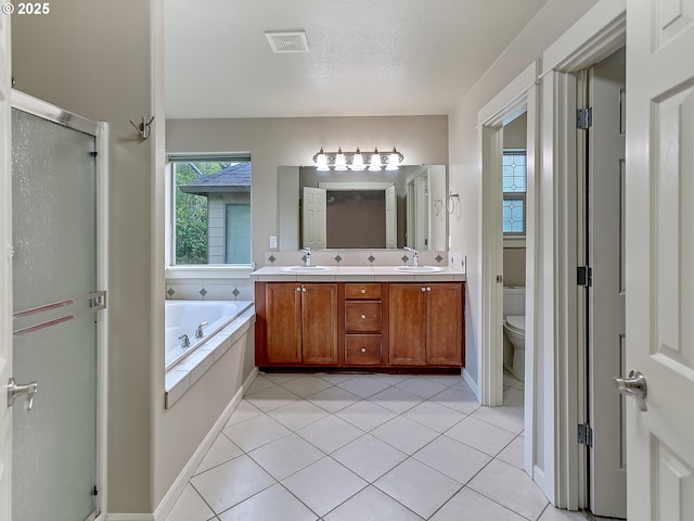 18840 SW Westland Ln, Beaverton, OR 97003 - bathroom with double vanity, a shower stall, a bath, and tile patterned flooring