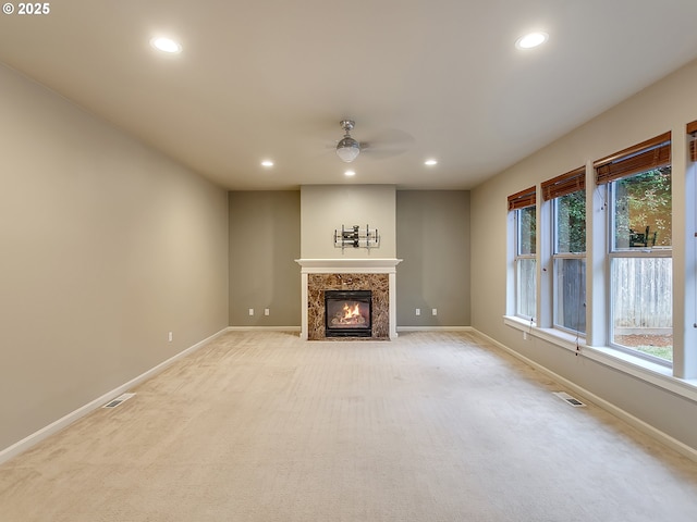 18840 SW Westland Ln, Beaverton, OR 97003 - unfurnished living room with recessed lighting, ceiling fan, light carpet, and a premium fireplace