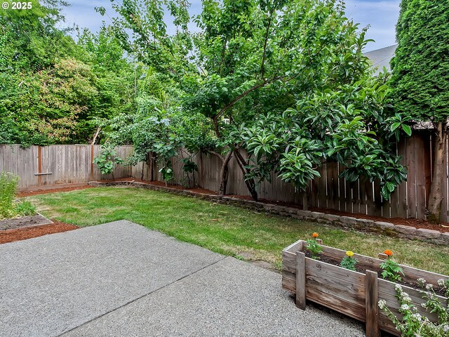 18840 SW Westland Ln, Beaverton, OR 97003 - fenced backyard featuring a vegetable garden and a patio