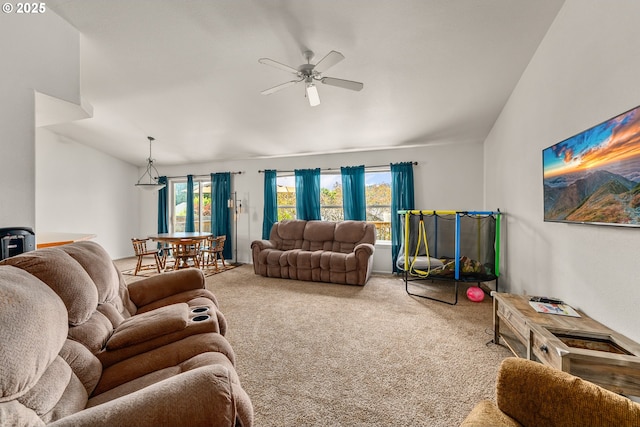 1232 E Fourth Ave, Sutherlin, OR 97479 - carpeted living room featuring a ceiling fan, a wood stove, and vaulted ceiling