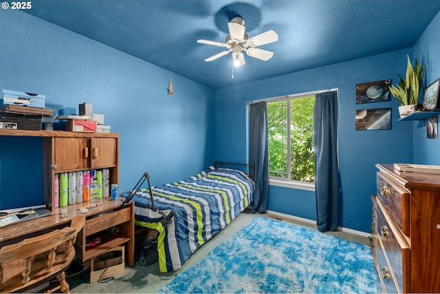 1232 E Fourth Ave, Sutherlin, OR 97479 - carpeted bedroom featuring baseboards and a ceiling fan