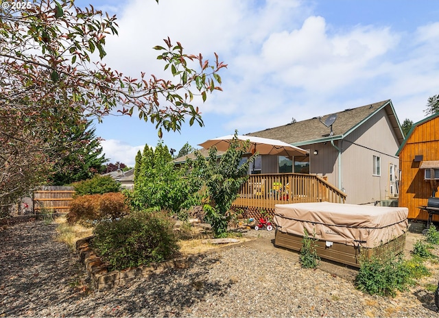 1232 E Fourth Ave, Sutherlin, OR 97479 - back of property featuring a hot tub and a deck