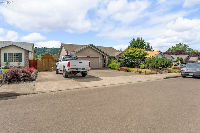 1232 E Fourth Ave, Sutherlin, OR 97479 - view of front facade featuring an attached garage and concrete driveway