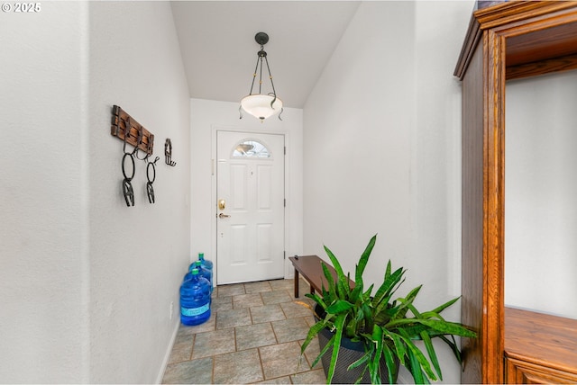 1232 E Fourth Ave, Sutherlin, OR 97479 - doorway to outside featuring stone finish flooring and baseboards
