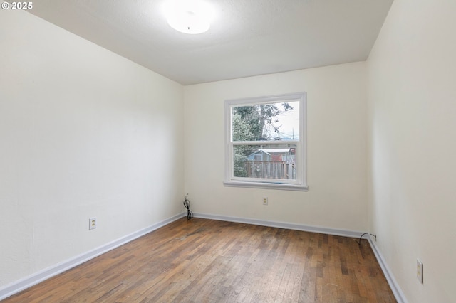 unfurnished room with hardwood / wood-style floors