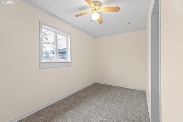 unfurnished room with ceiling fan and carpet flooring