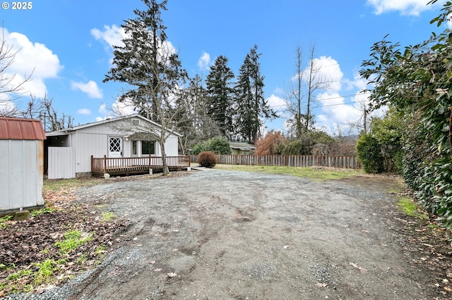 view of yard with a wooden deck