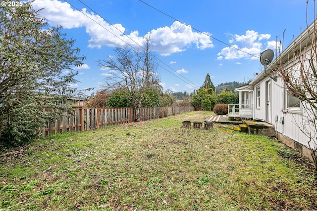 view of yard with a wooden deck