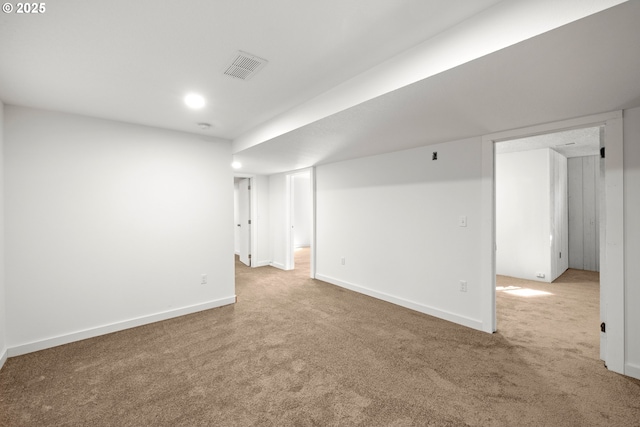 finished below grade area with recessed lighting, carpet, visible vents, and baseboards