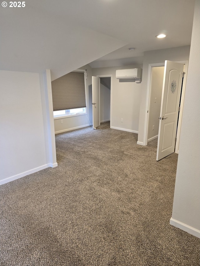 carpeted spare room featuring a wall mounted air conditioner