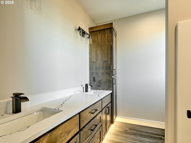 bathroom featuring hardwood / wood-style floors and vanity