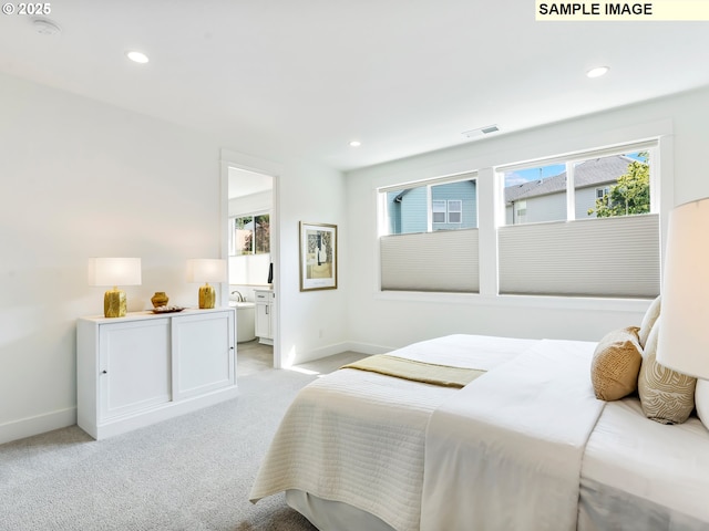 4958 N Adams Ct, Camas, WA 98607 - bedroom with baseboards, recessed lighting, light carpet, and ensuite bath