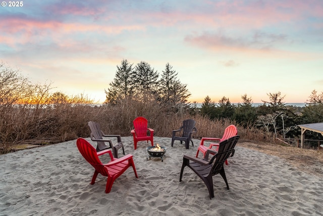 patio terrace at dusk with a fire pit