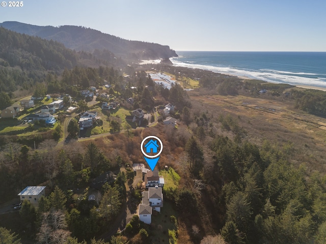 bird's eye view with a water and mountain view and a view of the beach