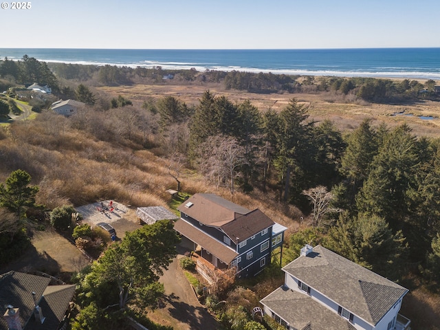 aerial view with a water view and a beach view