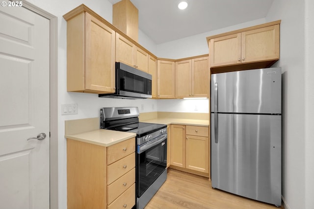1726 32nd St, Florence, OR 97439 - kitchen featuring stainless steel appliances, light brown cabinetry, light countertops, light wood-type flooring, and recessed lighting
