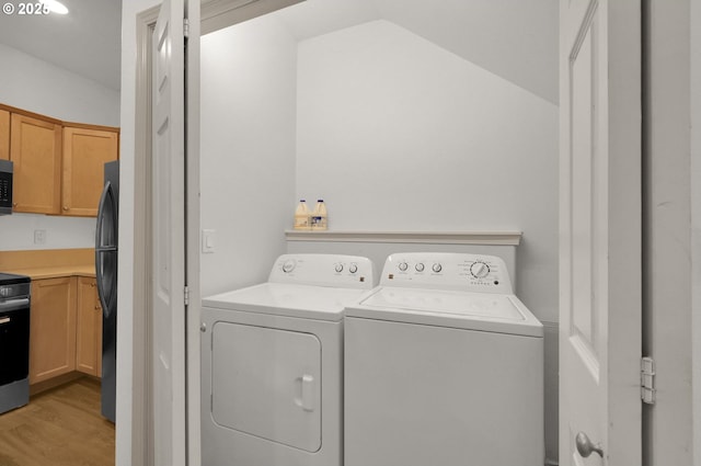 1726 32nd St, Florence, OR 97439 - laundry area featuring separate washer and dryer and light wood-style flooring