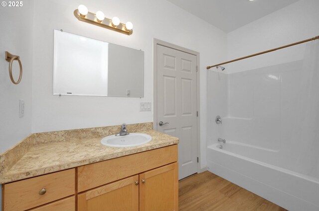 1726 32nd St, Florence, OR 97439 - bathroom featuring vanity, wood finished floors, and washtub / shower combination