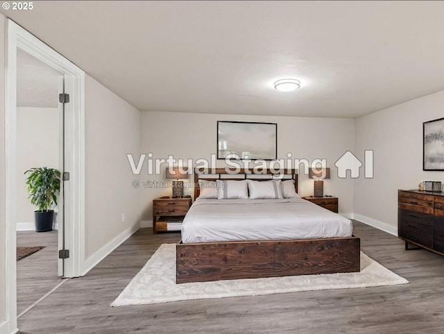 bedroom featuring wood-type flooring