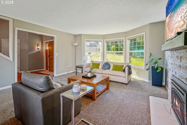 carpeted living room featuring a textured ceiling and baseboards