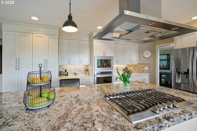 kitchen with white cabinets, tasteful backsplash, appliances with stainless steel finishes, and ventilation hood