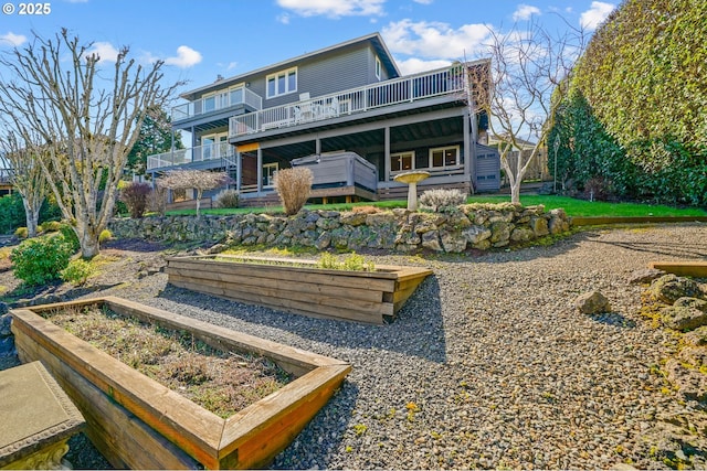 back of house with a garden