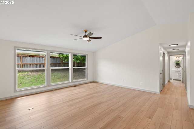 15080 SW 88th Ave, Portland, OR 97224 - empty room featuring a ceiling fan, vaulted ceiling, and light wood-style floors