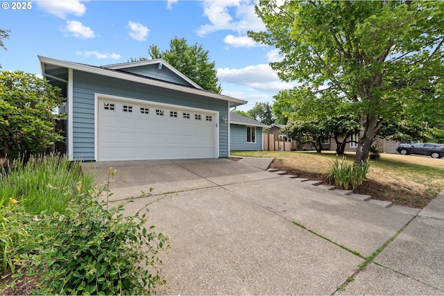 15080 SW 88th Ave, Portland, OR 97224 - view of front facade featuring concrete driveway and an attached garage
