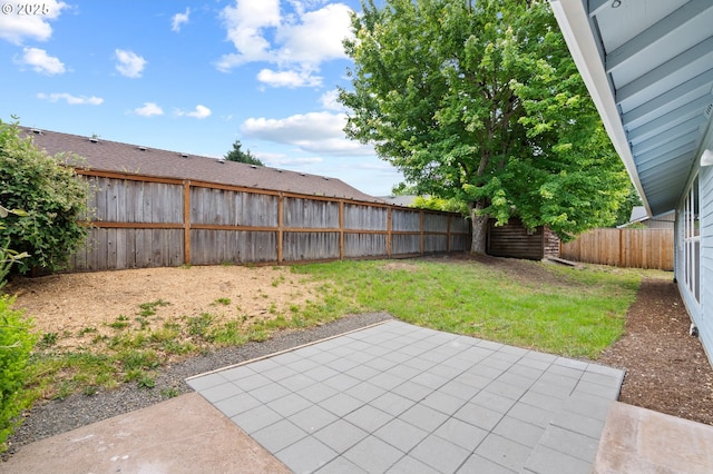 15080 SW 88th Ave, Portland, OR 97224 - fenced backyard with a patio area
