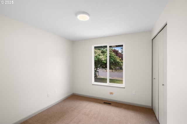 15080 SW 88th Ave, Portland, OR 97224 - unfurnished bedroom featuring light colored carpet and a closet
