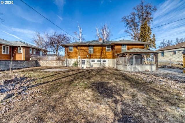 back of property with a gazebo