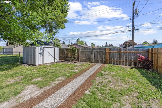 view of yard with a fenced backyard, a storage shed, and an outdoor structure