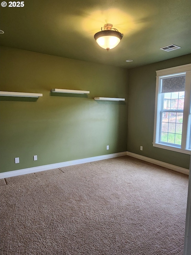 102 Sarah Bear Ln, Winston, OR 97496 - spare room with visible vents, carpet flooring, and baseboards