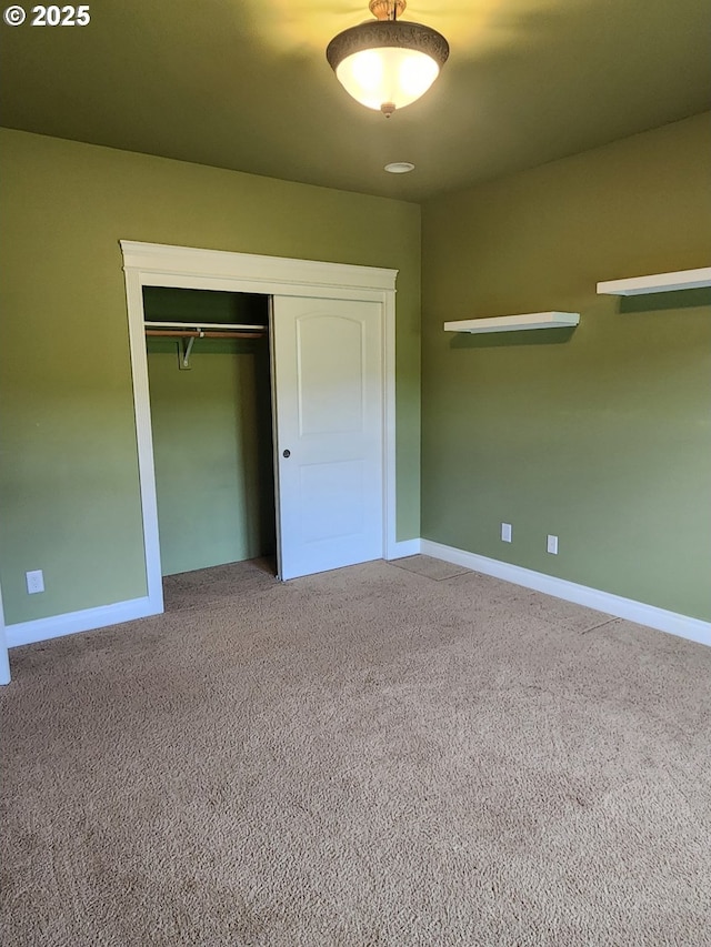 102 Sarah Bear Ln, Winston, OR 97496 - unfurnished bedroom featuring baseboards, carpet, and a closet