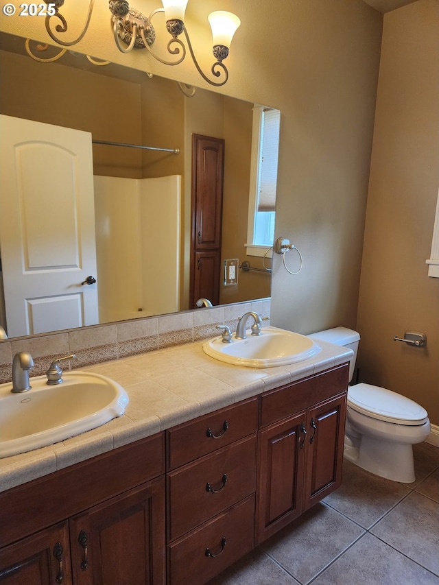 102 Sarah Bear Ln, Winston, OR 97496 - full bath featuring tile patterned floors, toilet, and a sink