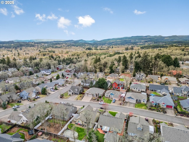 drone / aerial view with a residential view and a mountain view