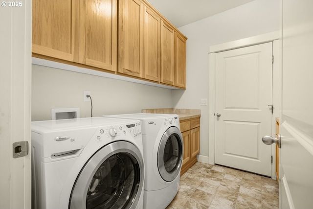 laundry room with cabinet space and independent washer and dryer