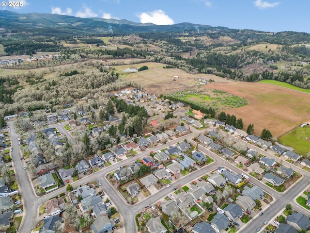 drone / aerial view with a residential view and a mountain view