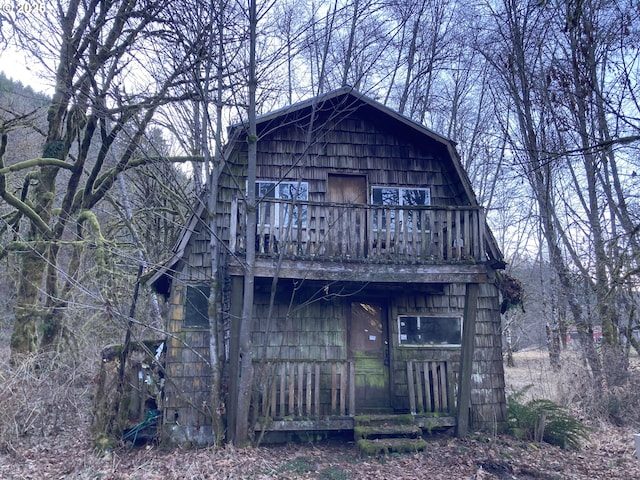 rear view of house with a balcony