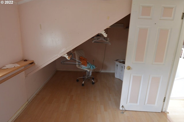 unfurnished office with light wood finished floors