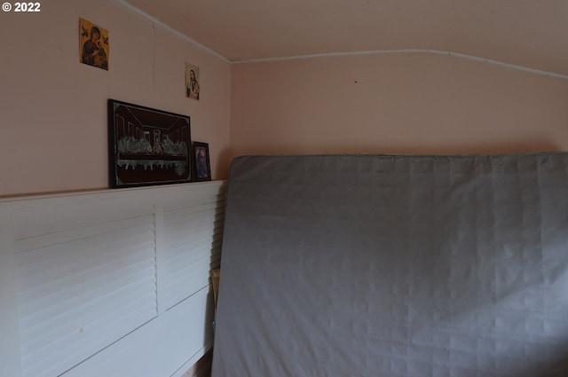 unfurnished bedroom with ornamental molding
