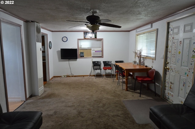 dining room featuring a textured ceiling, carpet floors, ceiling fan, and crown molding
